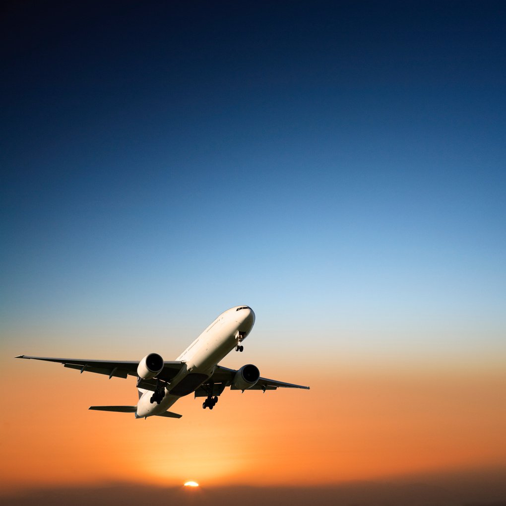 Aircraft Landing at Sunset